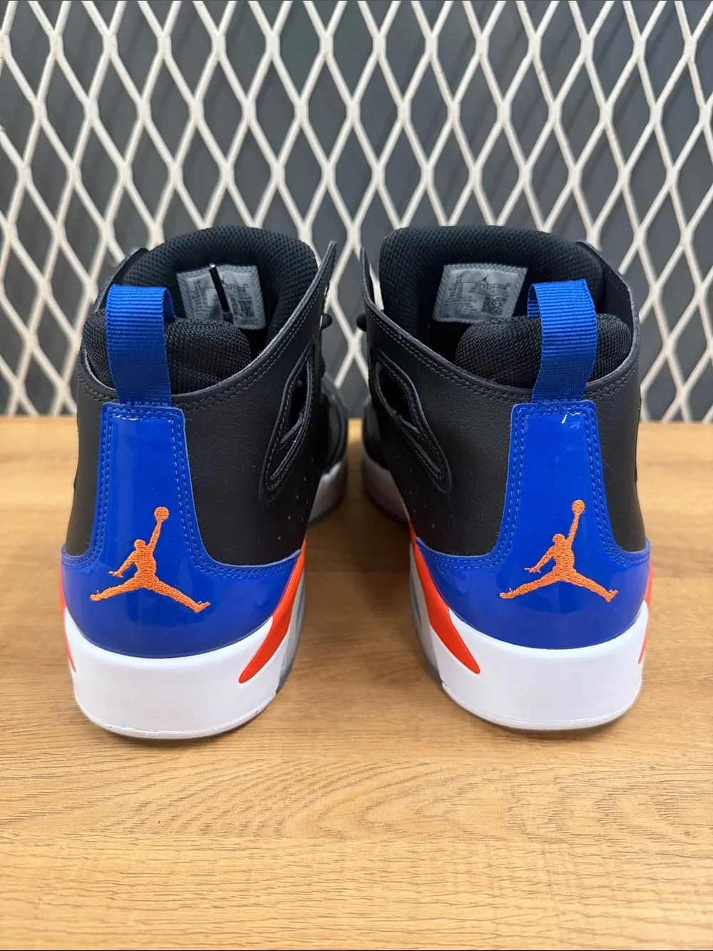 Jordan High-Top Sneakers in Black with Blue and Red Accents